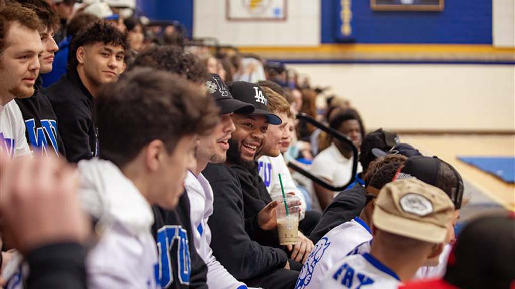Students in the stands at an athletic game 
