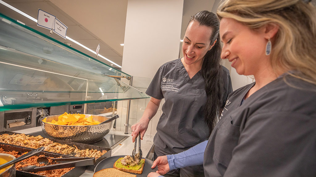 photos of two MSCND students building a meal in Snowden
