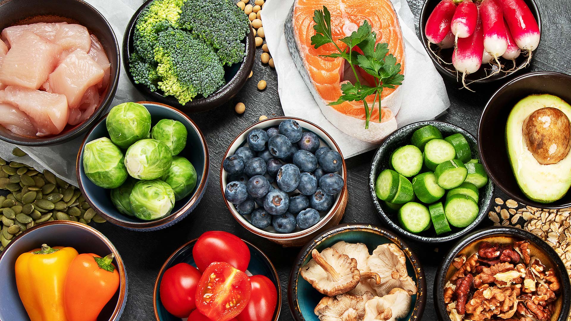 a colorful closeup of portions of different vegetables and grains