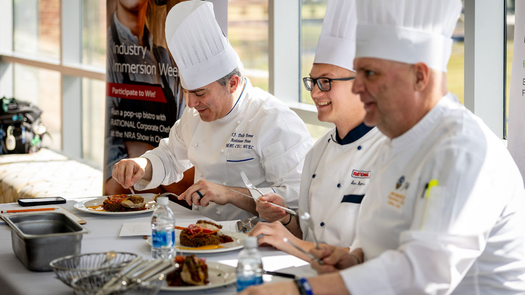 Judging the savory category, left to right: Assistant Dean TJ Delle Donne MAT, CEC, WCEC, Sam Burgess ’18 and Associate Professor Jeremy Houghton ’93, ’17 MBA