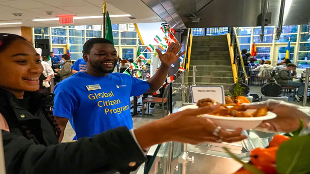 Student Ishmael showing excitement in dinning hall
