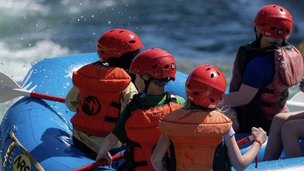 Youth guests whitewater rafting at the Whitewater Center