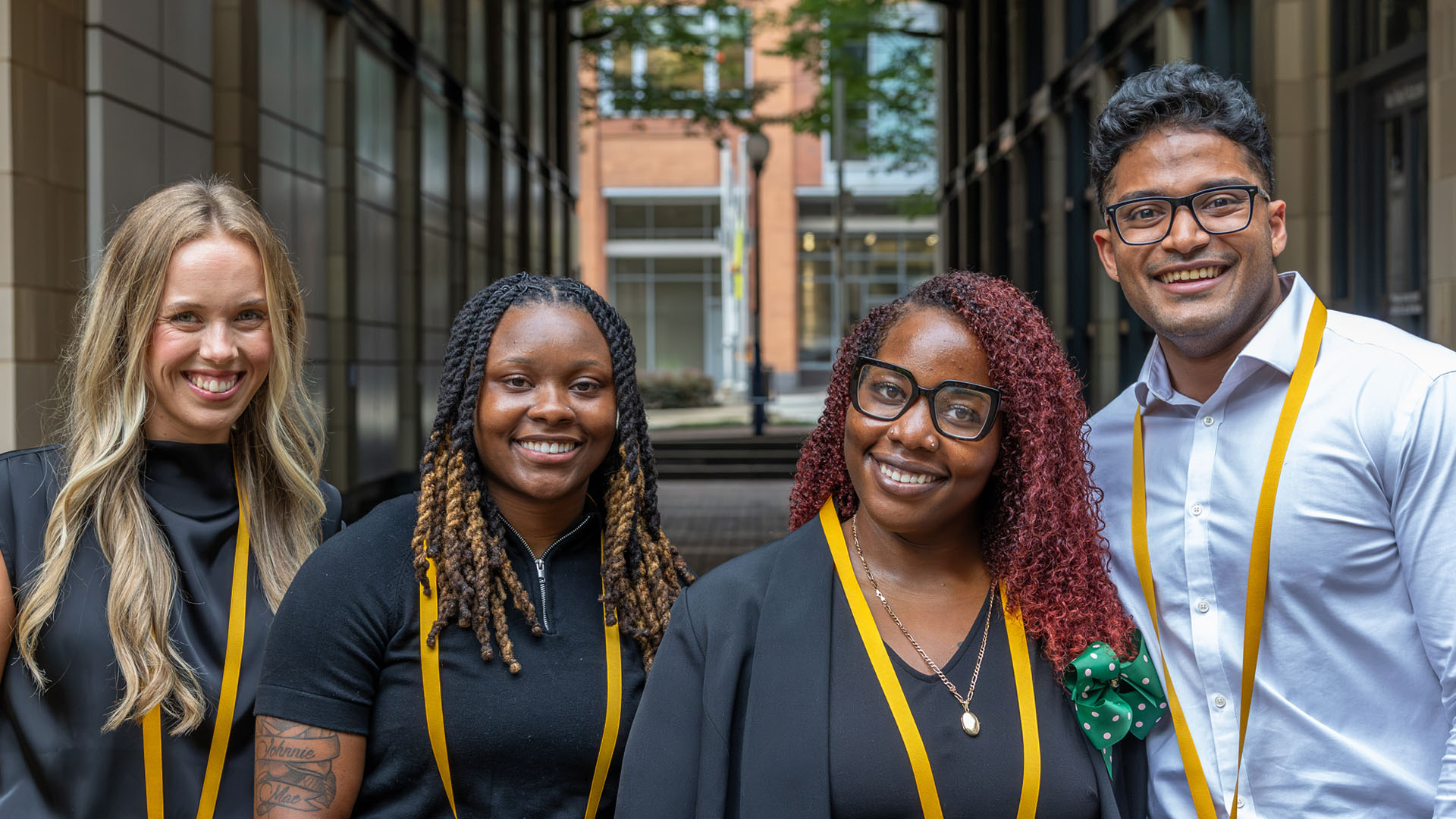 Four nursing students smiling at the camera.