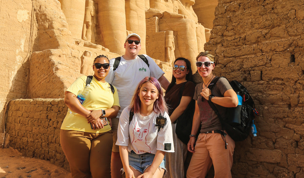 Students and Professor Rhodes in Egypt in front of pharaohs
