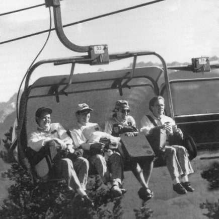 JWU Vail students taking a ski lift to get to class.