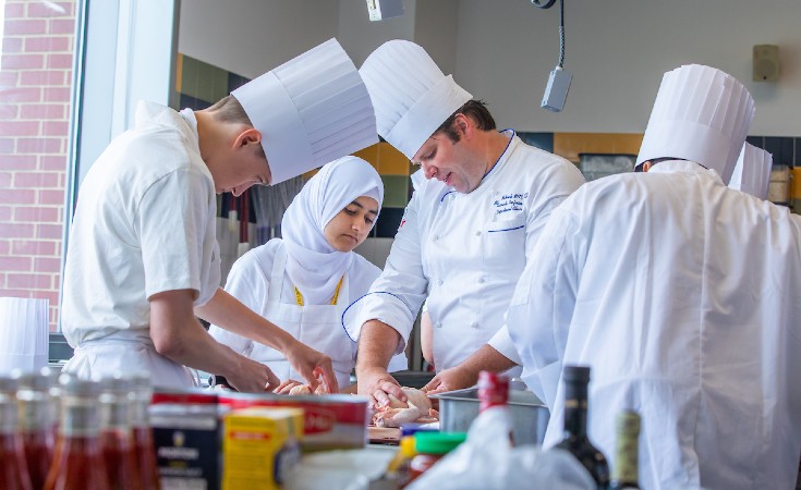 JWU students in a culinary lab