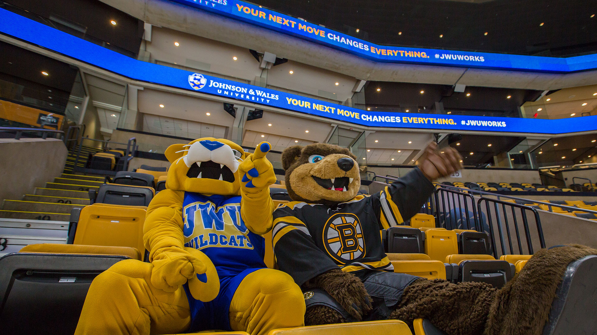 JWU and Boston Bruins mascot in arena