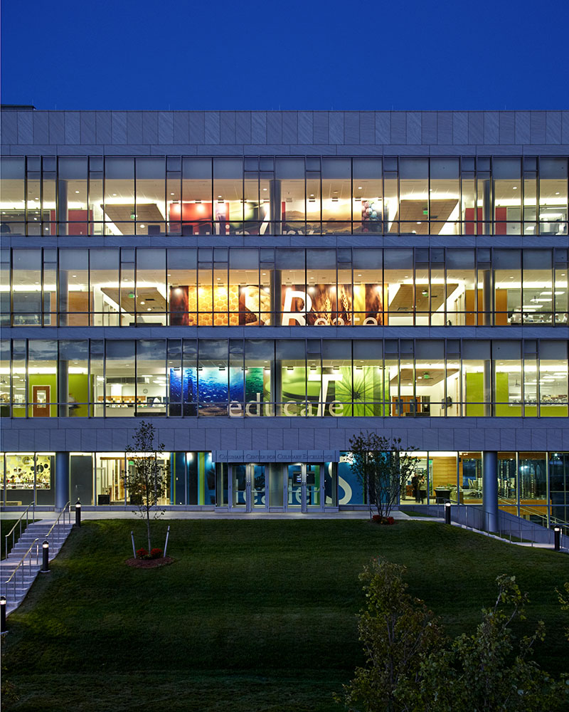 Outside view of the Cuisinart Center for Culinary Excellence, lit up at night.