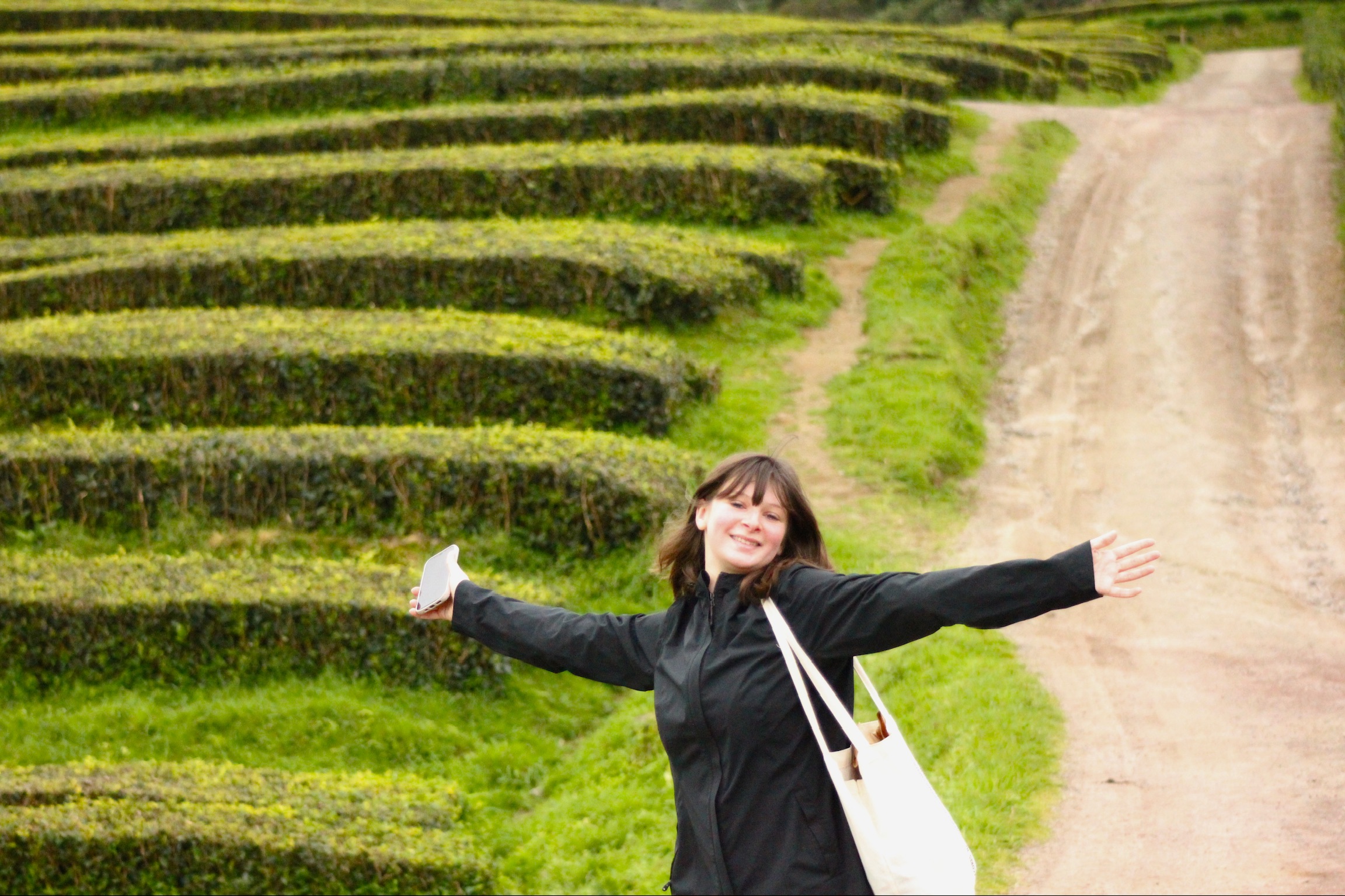 photo of Abby Vandiver posing in a field in Portugal