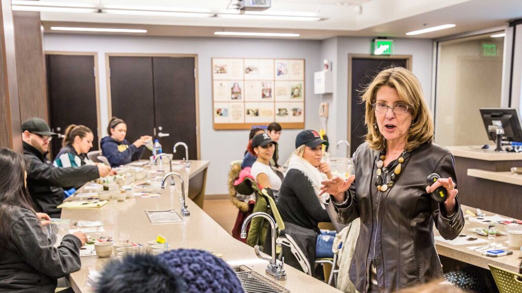 Cynthia Bigelow speaks to a group of hospitality students.
