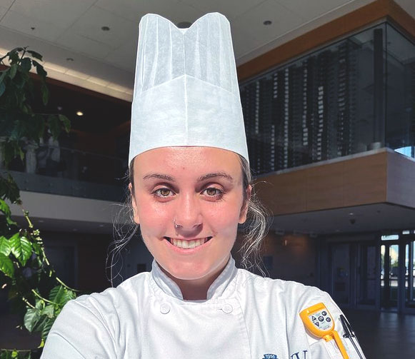Portrait photo of Toniann Rizzuto in her chef uniform.