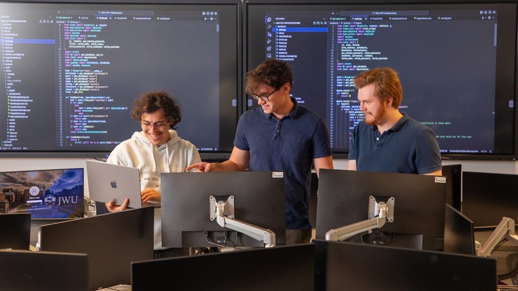 Jordan Limor ’24, Andrew Bugera ’24 and Christopher Lorme ’24 during the design phase of their Cyberpaw capture-the-flag game.