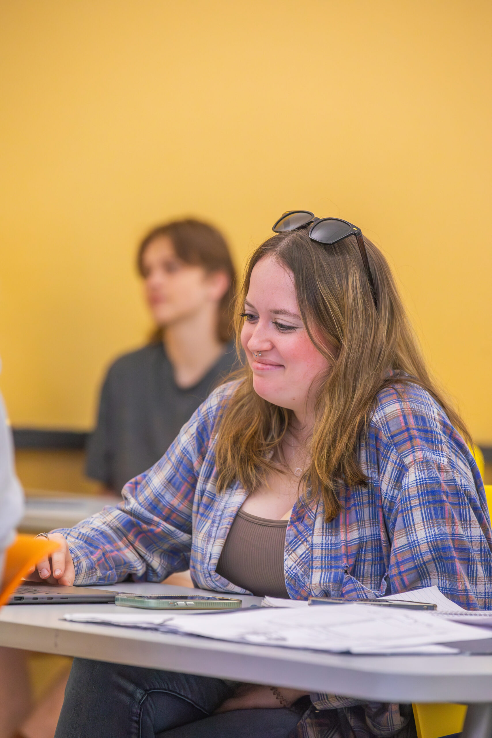 Female student sitting a desk