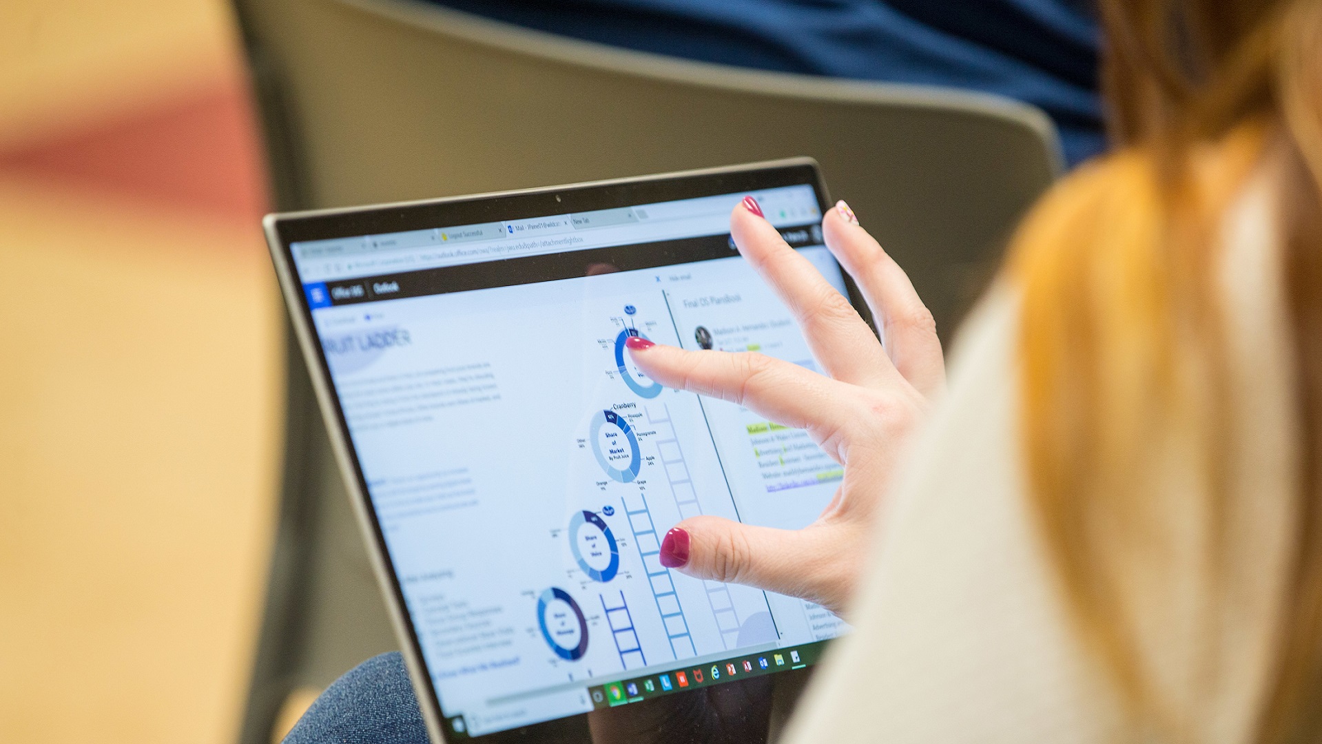 Female student reviewing data chart online