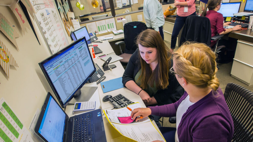 Accounting MBA students in computer lab working on project