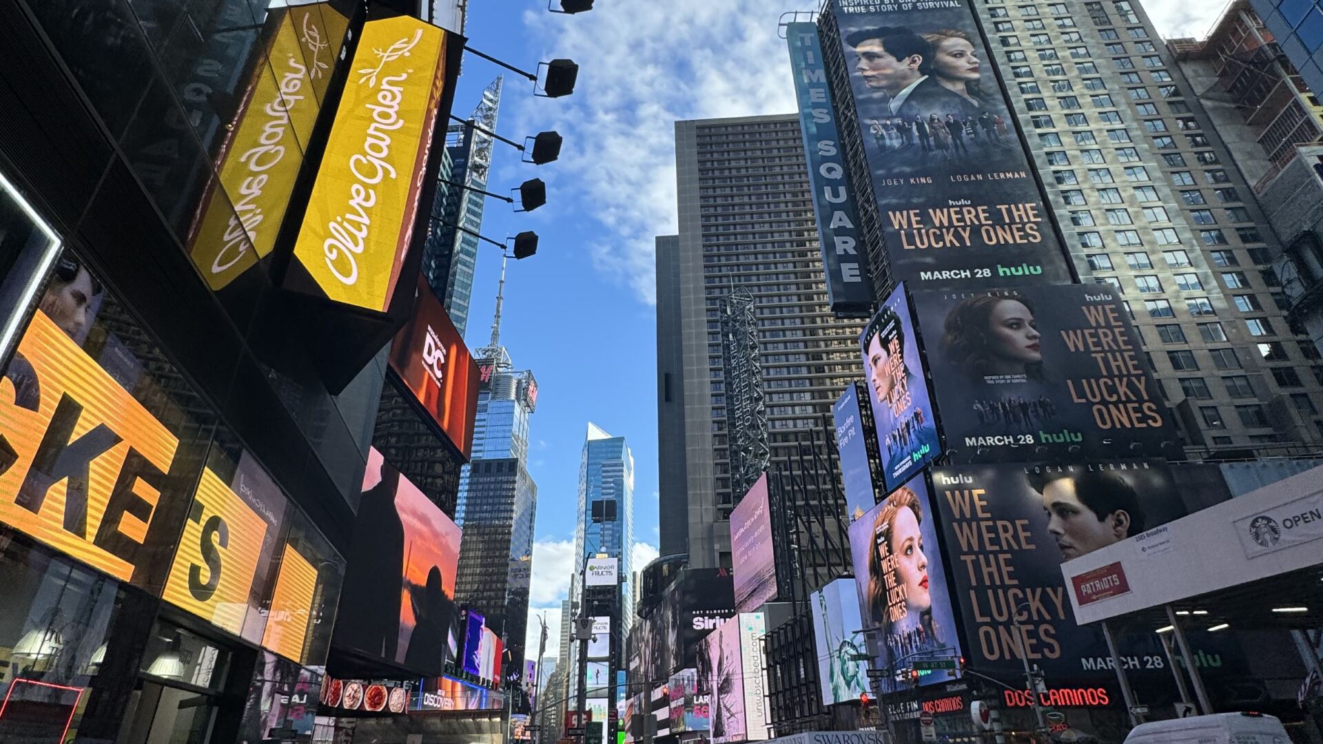 Street view of a row of skyscrapers in New York City.