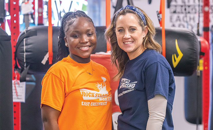 Geraldine Gibson ’25 OTD (left) at Rock Steady Boxing with an instructor.