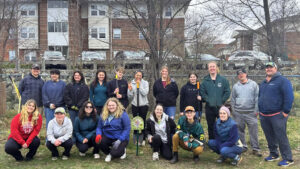 JWU students taking part in a tree planting event on the Harborside Campus. 