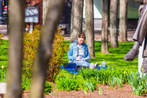 Student sits in Gaebe Commons