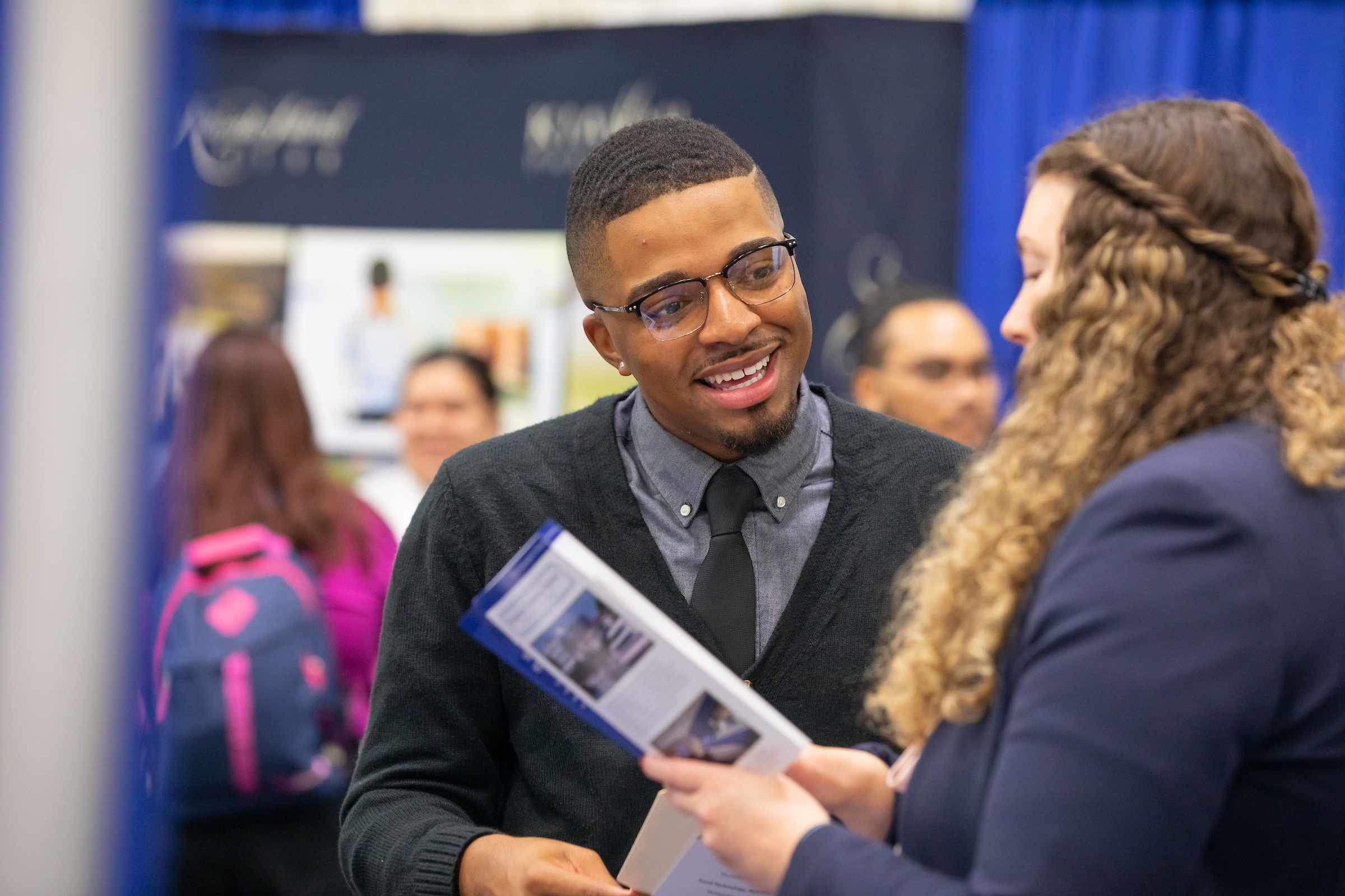 Student visits w potential employers during the career fair