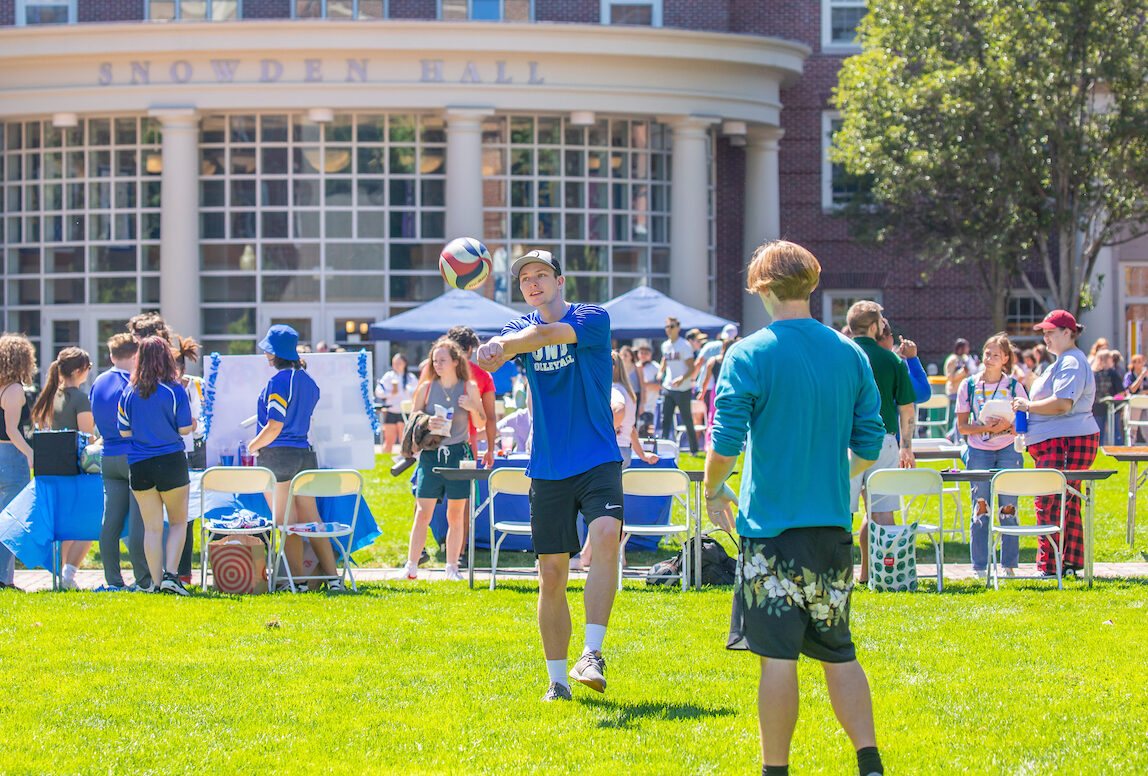 Students outside playing volleyball