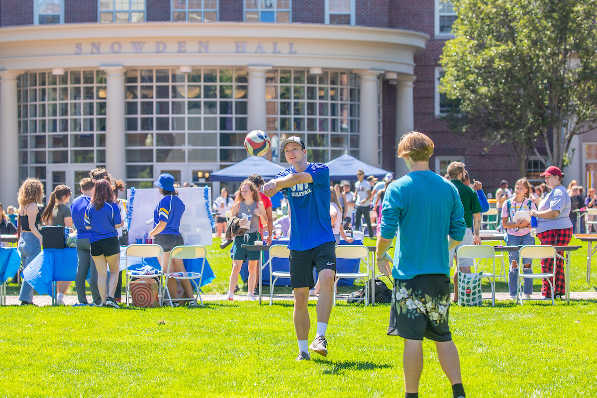 Students outside playing volleyball