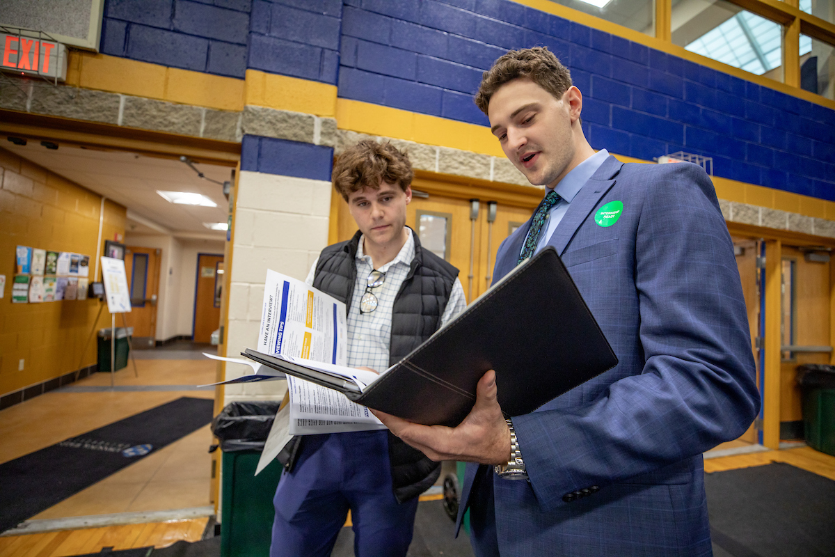 Male students prep for career fair in the Wildcat Center