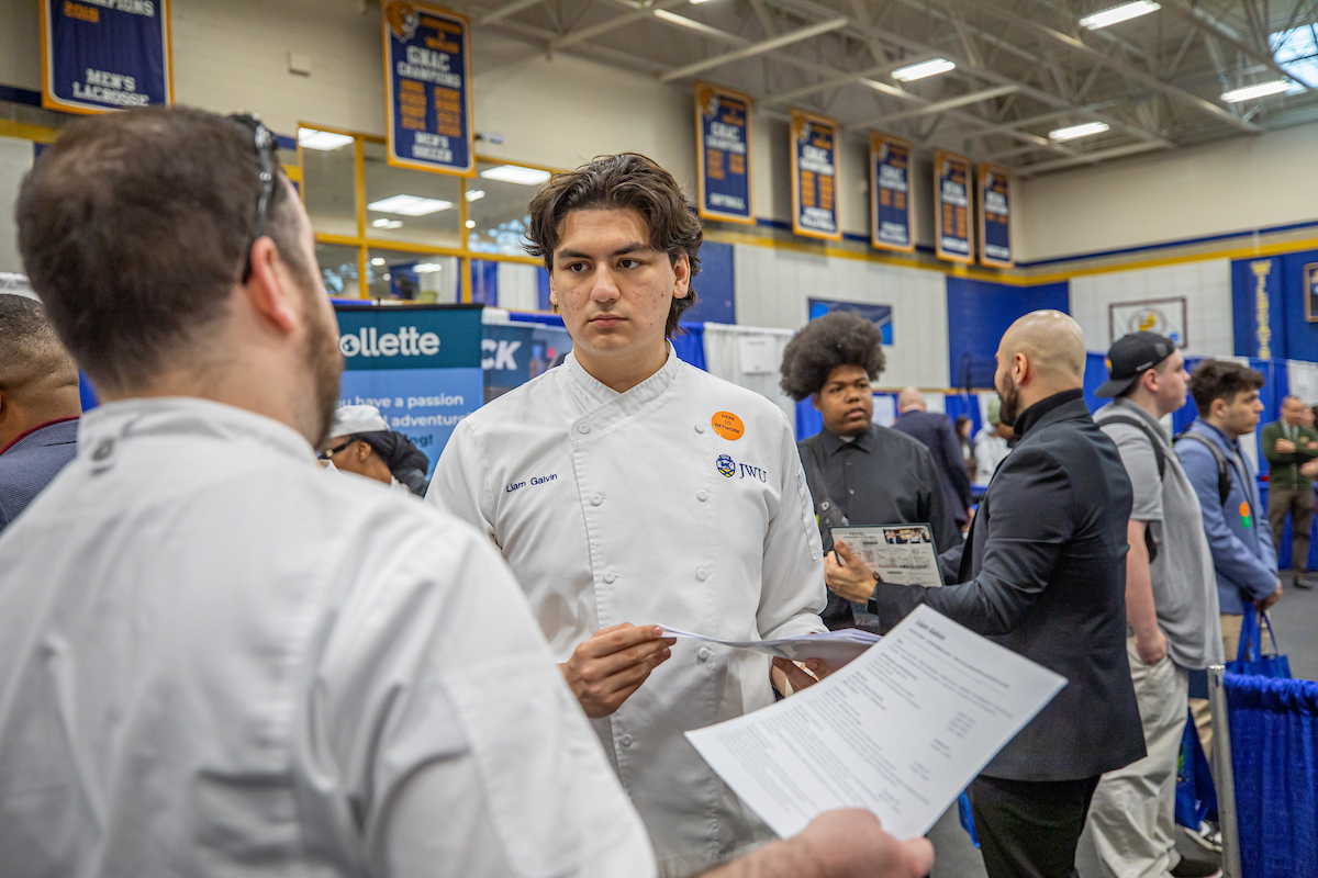 Student attends career fair interviewing for an internship