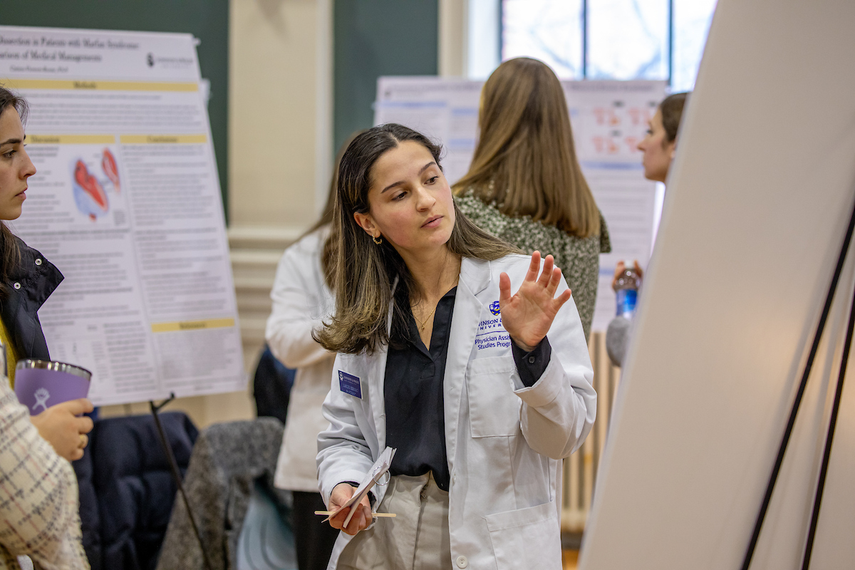 Student presents research during a symposium