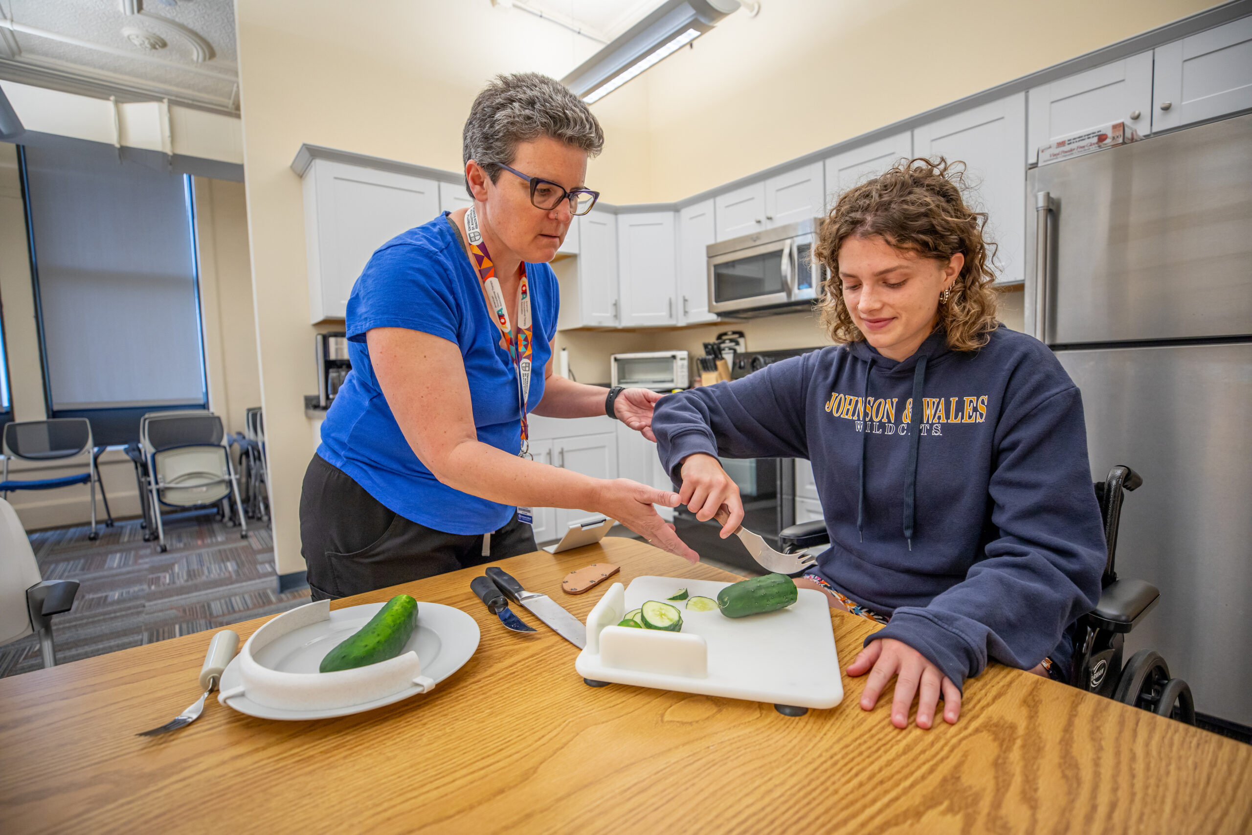 Therapist helping patient prepare food