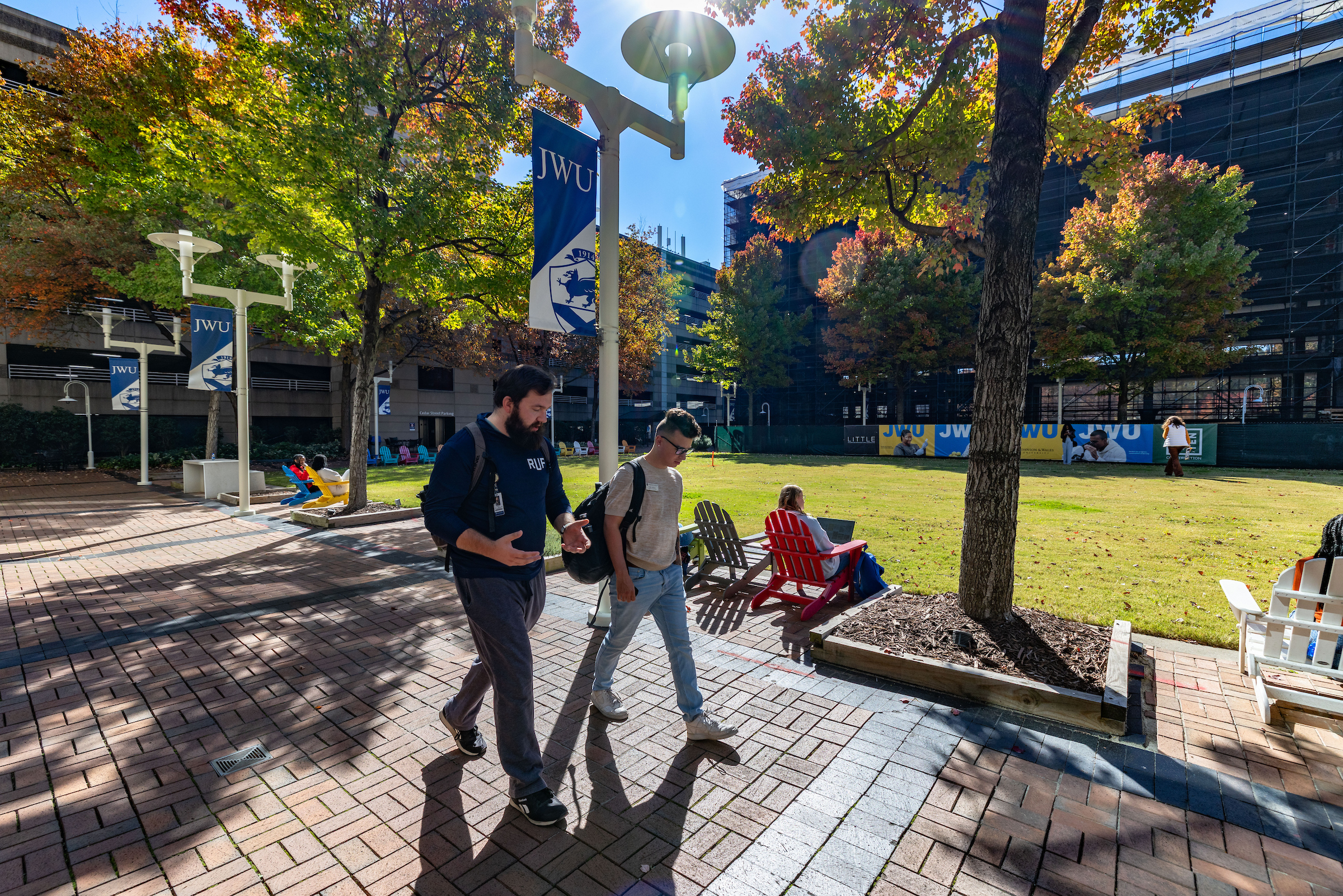 Students walking on campus in the Fall