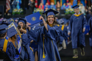 Student celebrates receiving her diploma