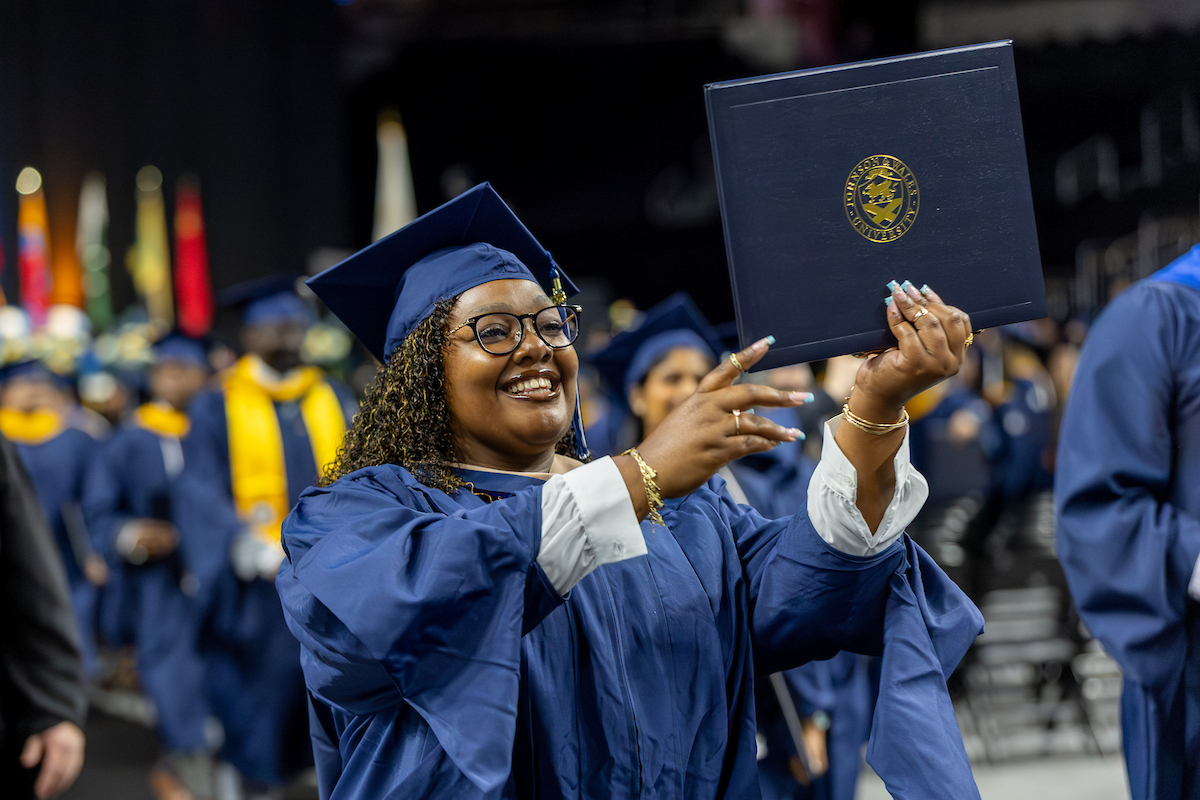 Student celebrates with her diploma