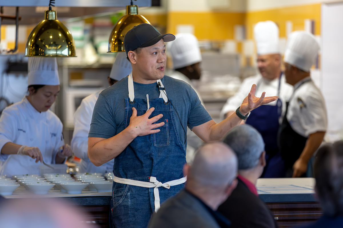 Chef Shi Mei ’10 addresses guests during the Providence Epicurean Scholarship Society’s annual dinner 