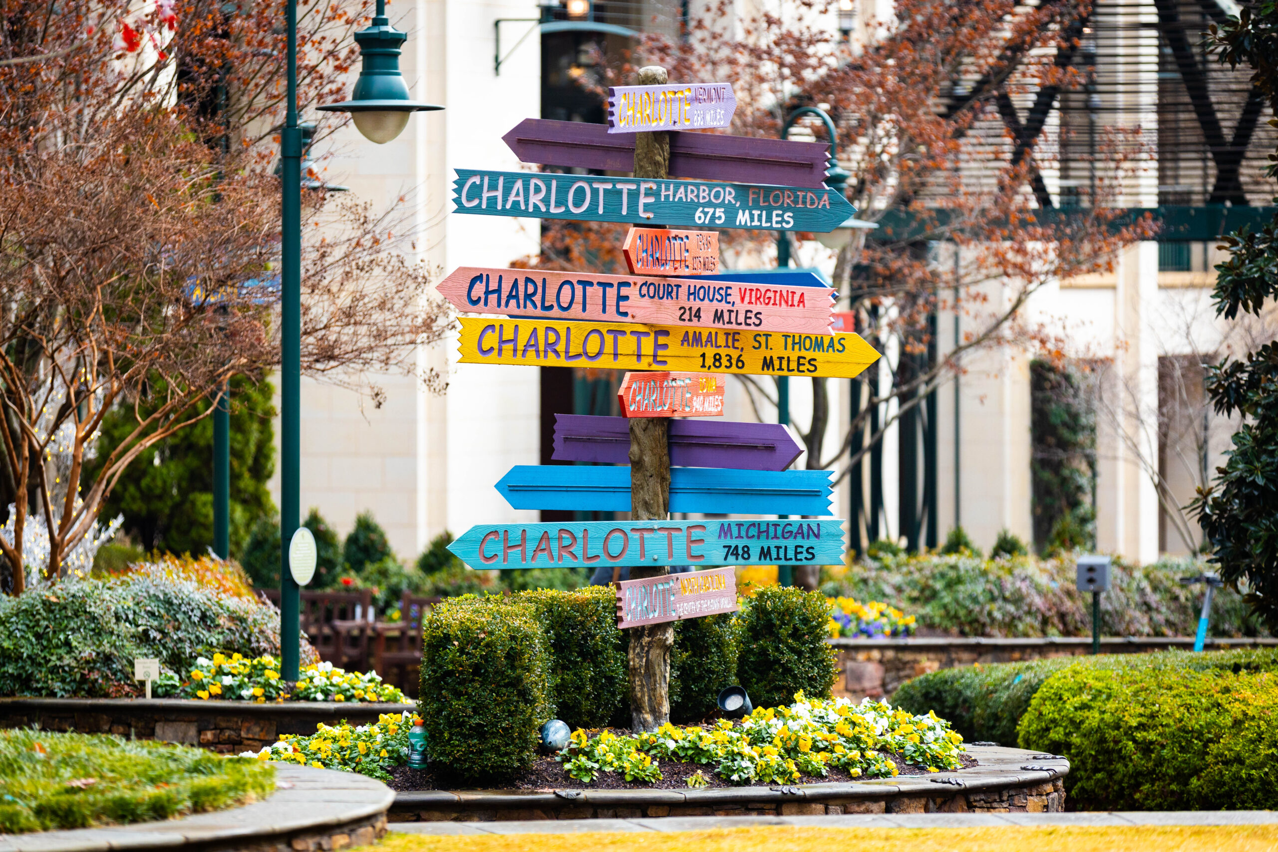 Signs from downtown Charlotte stating how far other cites are away