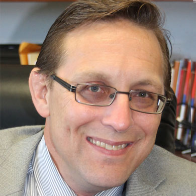 Headshot of Michael S. Barnes.