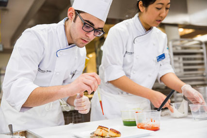 culinary student using dropper