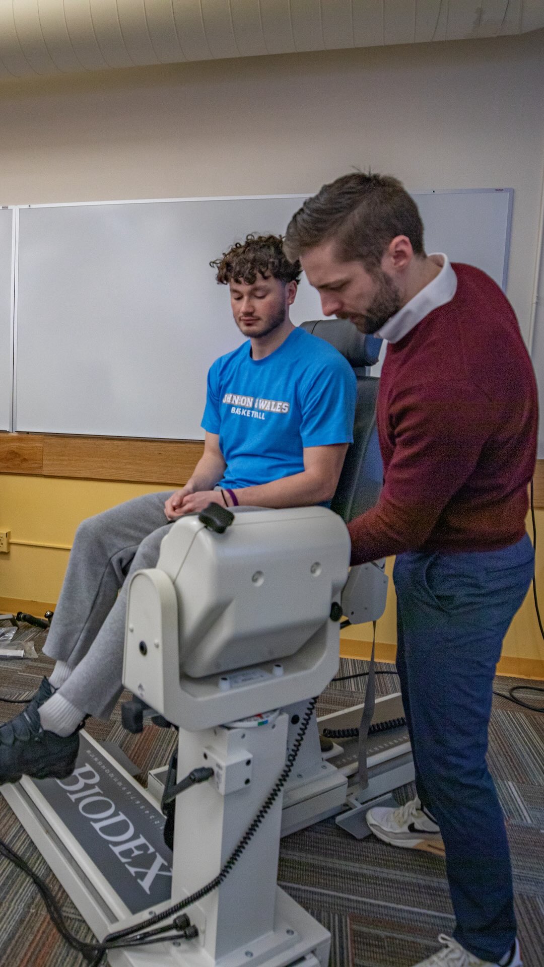 Student assists another student acting as a patient in the exercise science lab