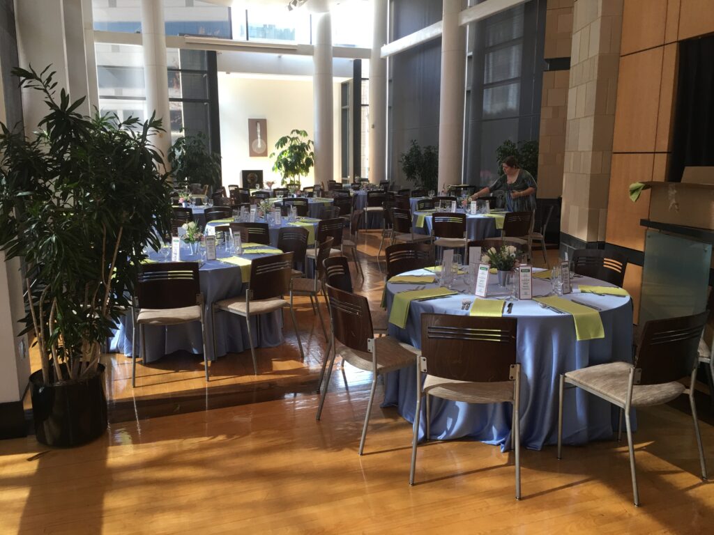 The University Events Center (UEC) in Charlotte with a formal dinner table layout.