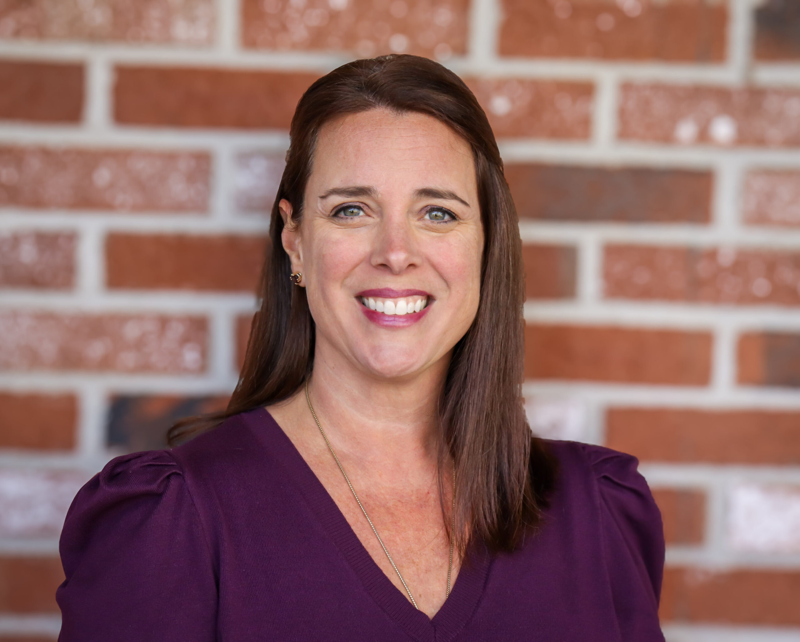 A person smiling for a photo.