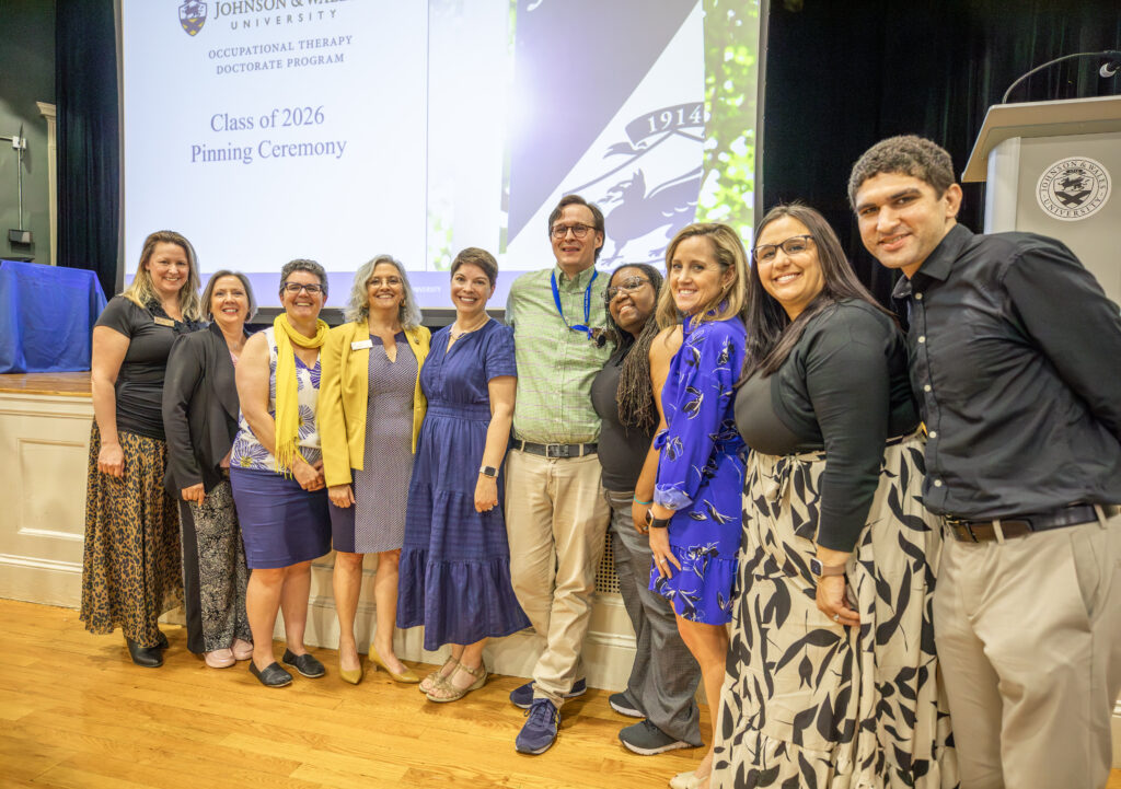 A group of individuals poses together at the Johnson & Wales University Occupational Therapy Doctorate Program Class of 2026 Pinning Ceremony.