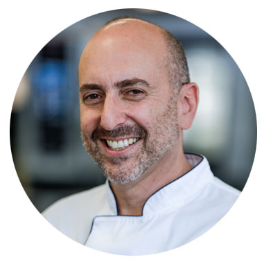 Chef Daniel Lessem of RATIONAL in his chef whites.