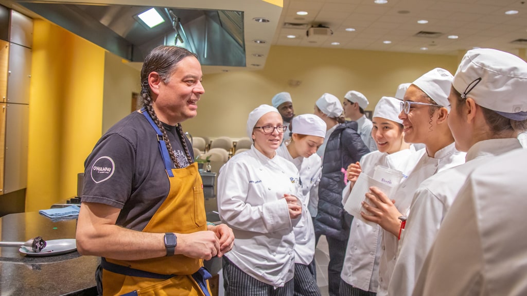 Sean Sherman chats with culinary students at JWU Providence's College of Food Innovation & Technology.