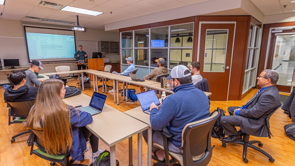 members of the Wildcat Investment Fund gather in the Strategy Lab