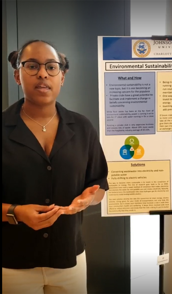 Alexandra Plummer standing with Environmental Sustainability project