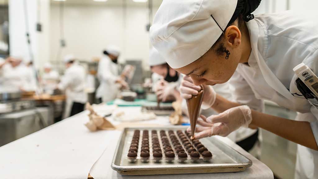 Baking & Pastry student in the Chocolate Lab on the Charlotte Campus.