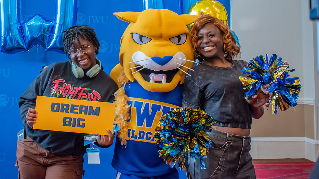 Two women with Wildcat Willie at Accepted Students Day
