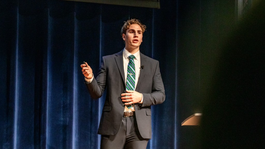 Alexander Raglin presenting on stage