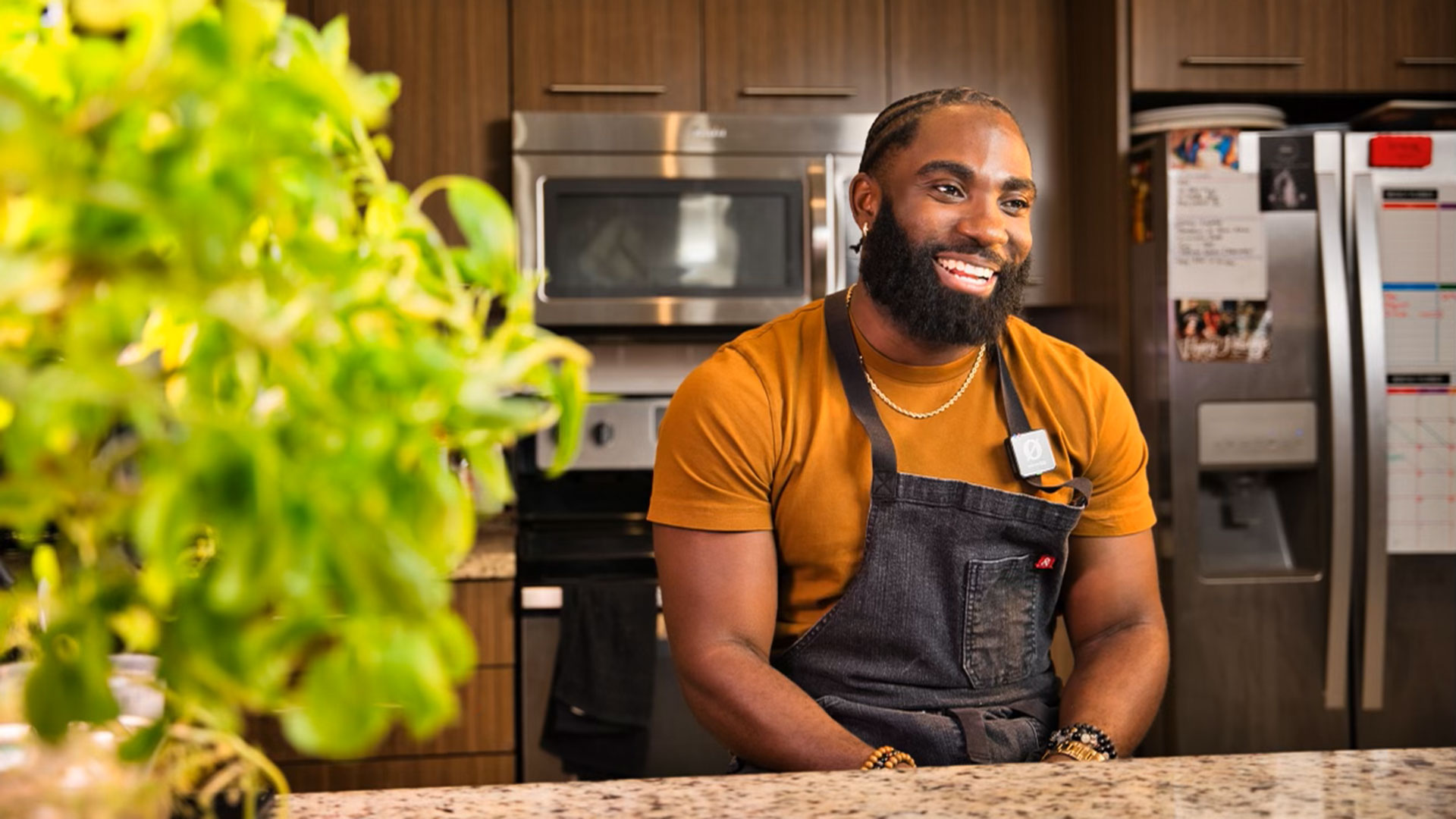 u0022Chef Nolu0022 Foretia '16 sits smiling at a kitchen countertop
