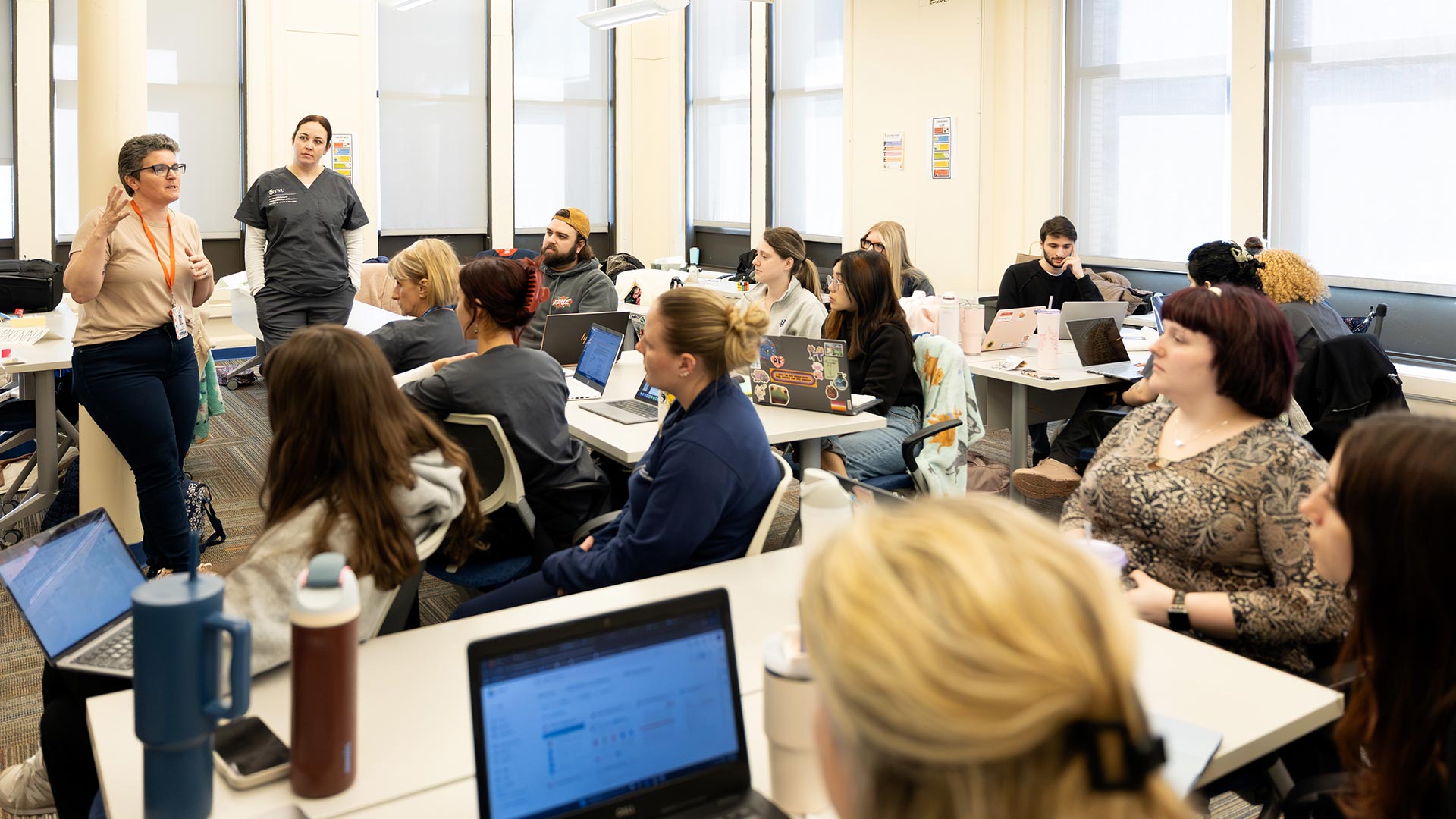 faculty members Kate Burke and Kara Cucinotta address OTD and MSCND students
